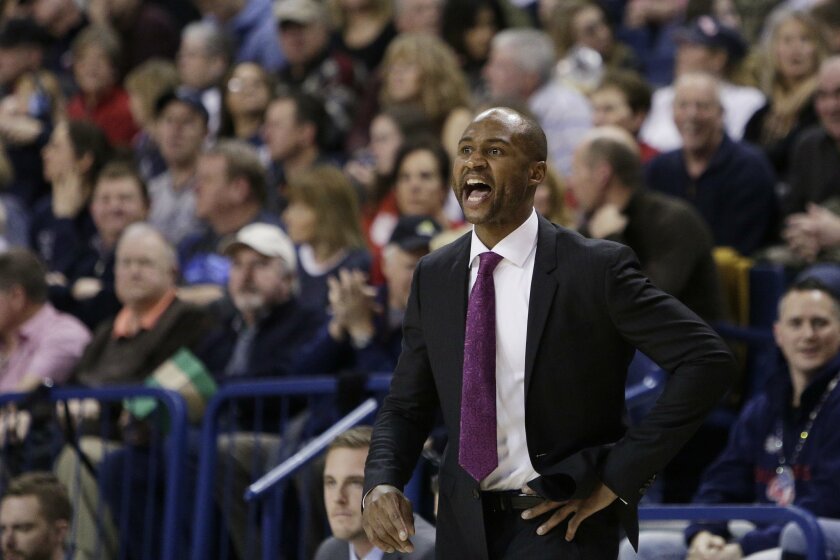San Diego coach Lamont Smith talks to his team during the first half of an NCAA college basketball game against Gonzaga, Saturday, Jan. 16, 2016, in Spokane, Wash. (AP Photo/Young Kwak)