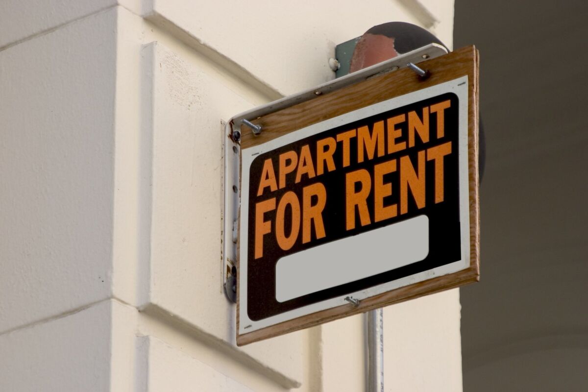 An "apartment for rent" sign.