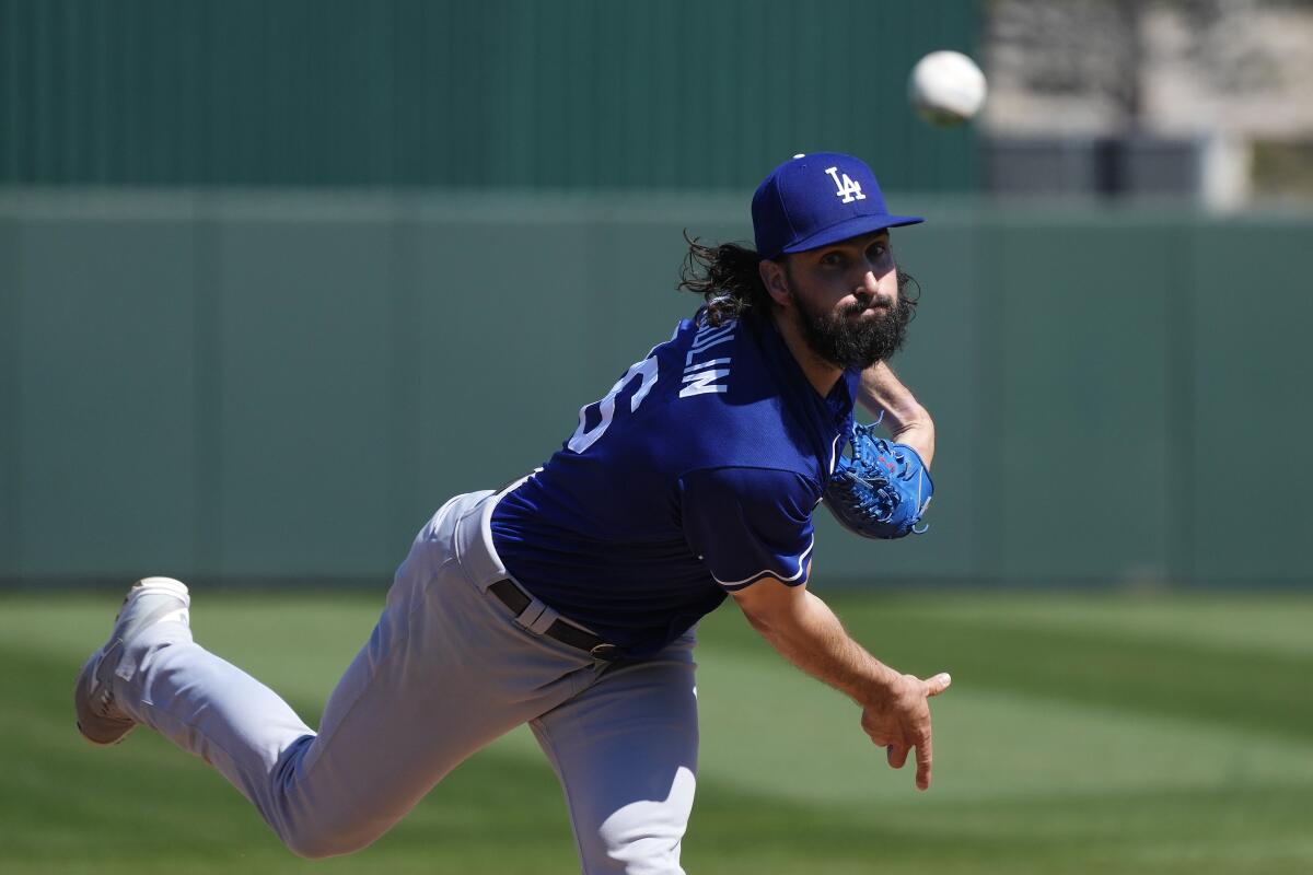 Los Angeles Dodgers starting pitcher Tony Gonsolin warms up during the first inning.
