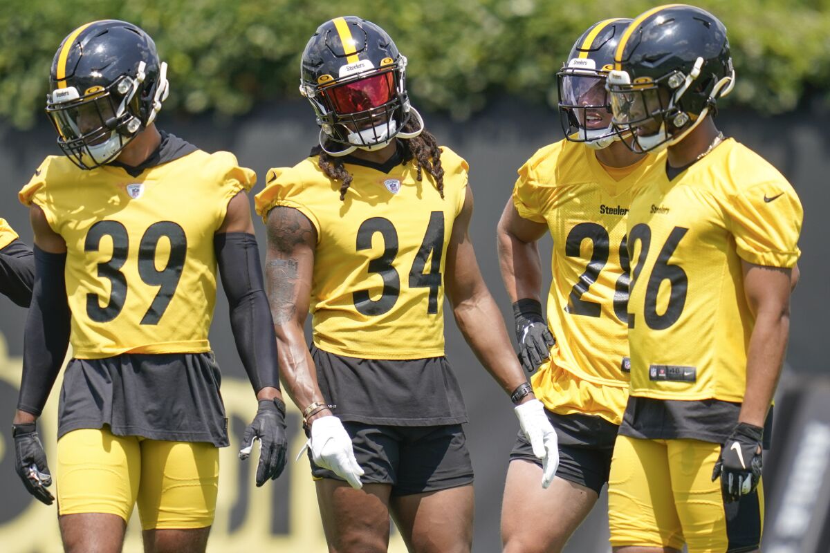 Pittsburgh Steelers strong safety Terrell Edmunds (34) stands with safety Donovan Stiner (26), free safety Minkah Fitzpatrick (39), and safety Miles Killebrew (28) during an NFL football practice, Thursday, July 22, 2021, in Pittsburgh. (AP Photo/Keith Srakocic)