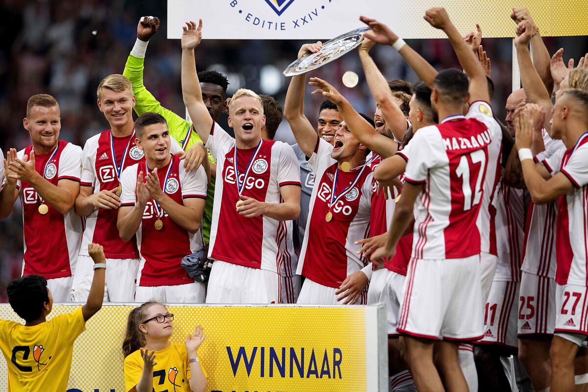Ajax Amsterdam's players celebrate after winning the Dutch Super Cup football final match between Ajax Amsterdam and PSV Eindhoven at the Johan Cruijff Arena in Amsterdam, on July 27, 2019. (Photo by Olaf KRAAK / ANP / AFP) / Netherlands OUTOLAF KRAAK/AFP/Getty Images ** OUTS - ELSENT, FPG, CM - OUTS * NM, PH, VA if sourced by CT, LA or MoD **