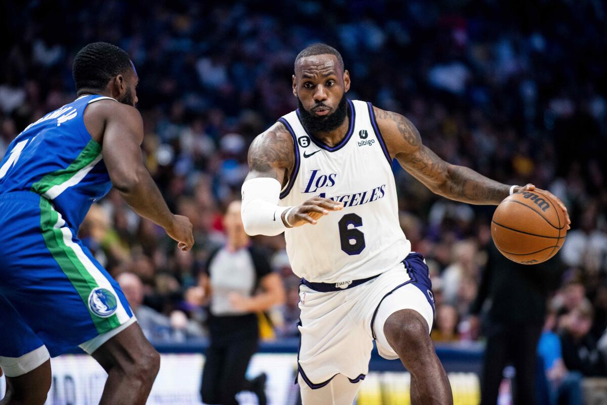 Lakers star LeBron James drives to the basket against the Dallas Mavericks on Dec. 25, 2022.