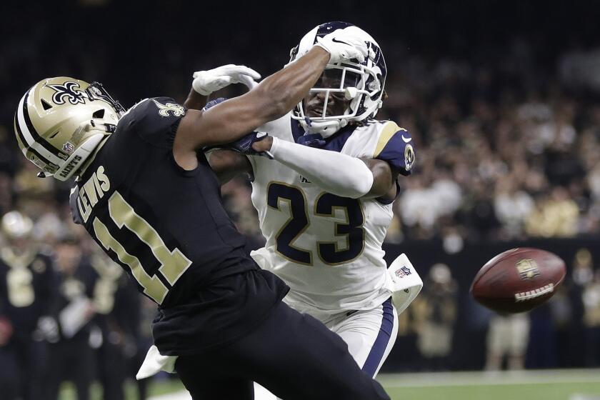 FILE - In this Jan. 20, 2019, file photo, Los Angeles Rams' Nickell Robey-Coleman (23) breaks up a pass intended for New Orleans Saints' Tommylee Lewis during the second half of the NFL football NFC championship game in New Orleans. The blatant non-call late in the NFC championship game caused passionate consternation among Saints fans and led to calls for change in the NFL’s replay system. But there is not a lot of support for such a change because of the time it would add to games. (AP Photo/Gerald Herbert, File)