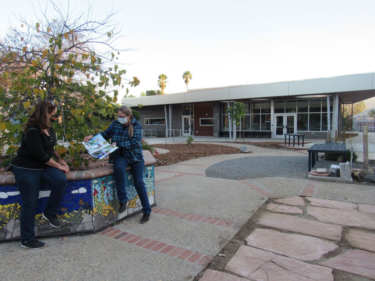 Cuyamaca College instructor Diane Citrowske (right) talks to Ornamental Horticulture student Tricia Daley.
