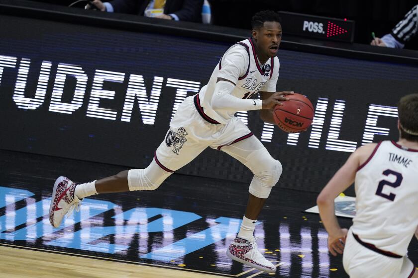 Gonzaga guard Joel Ayayi drives up court during the first half of a men's Final Four NCAA college basketball tournament.
