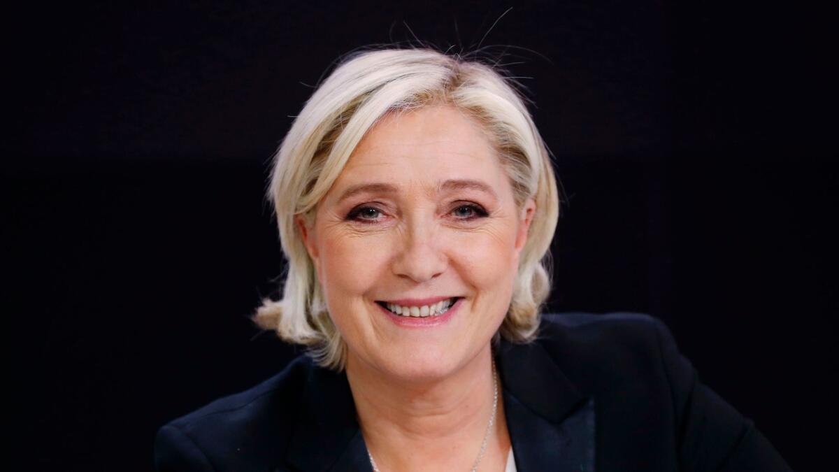 French presidential candidate Marine Le Pen waits before an interview in Paris on April 24, 2017.