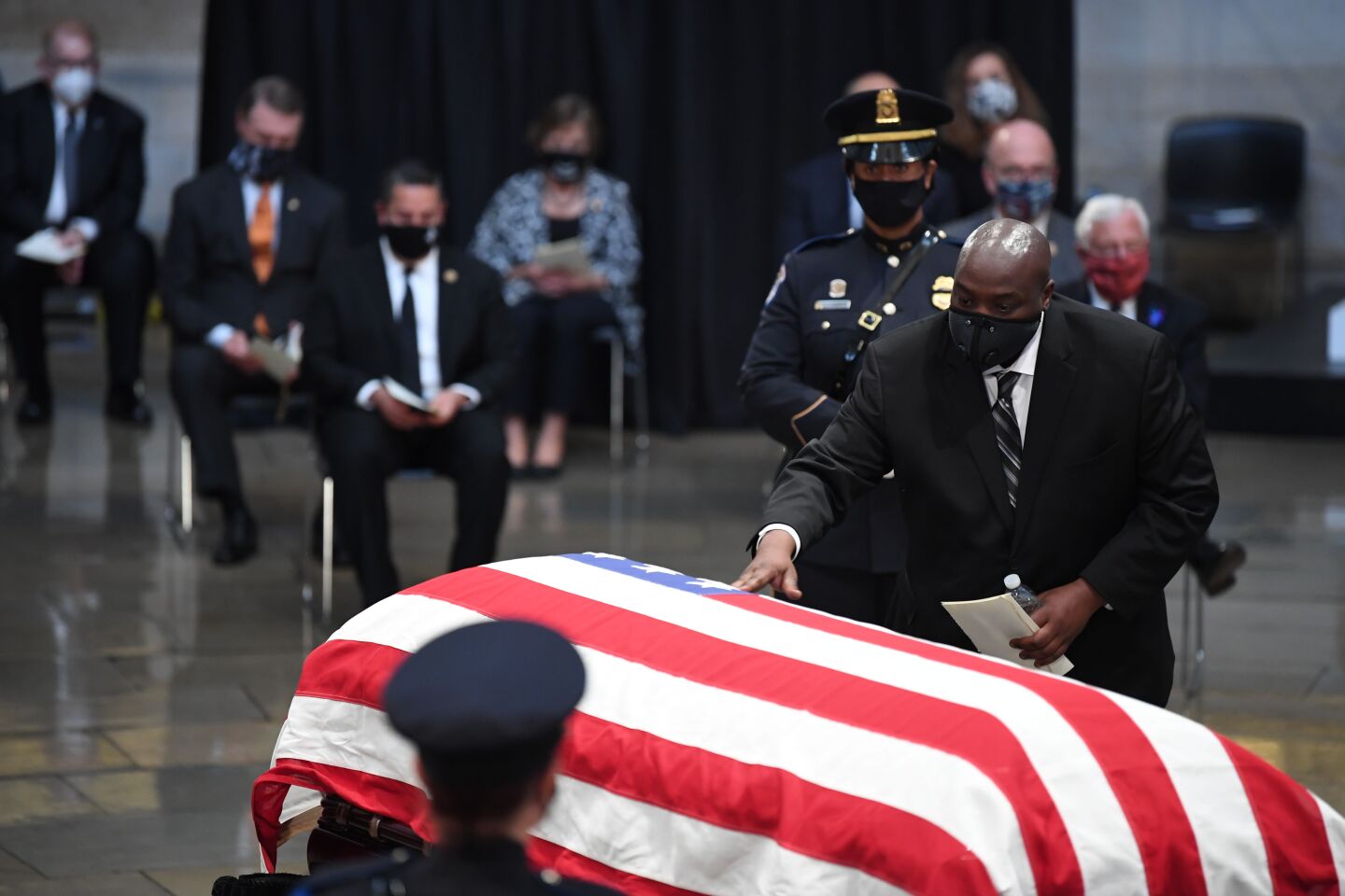 John-Miles Lewis touches the casket of his father, the late Rep. John Lewis, D-GA, a key figure in the civil rights movement in the Rotunda of the US Capitol in Washington, DC.