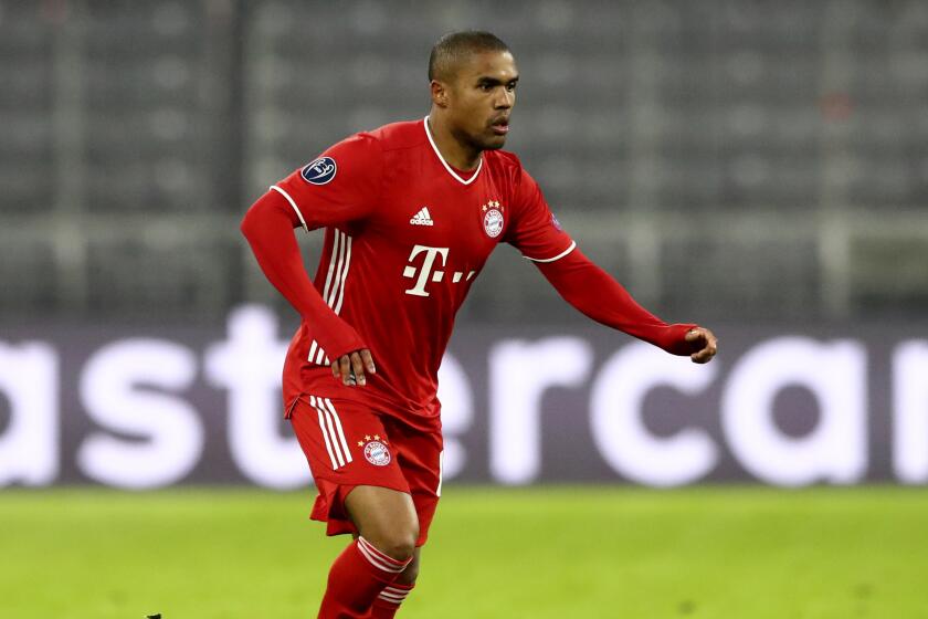 Bayern's Douglas Costa controls the ball during the Champions League group A soccer match.