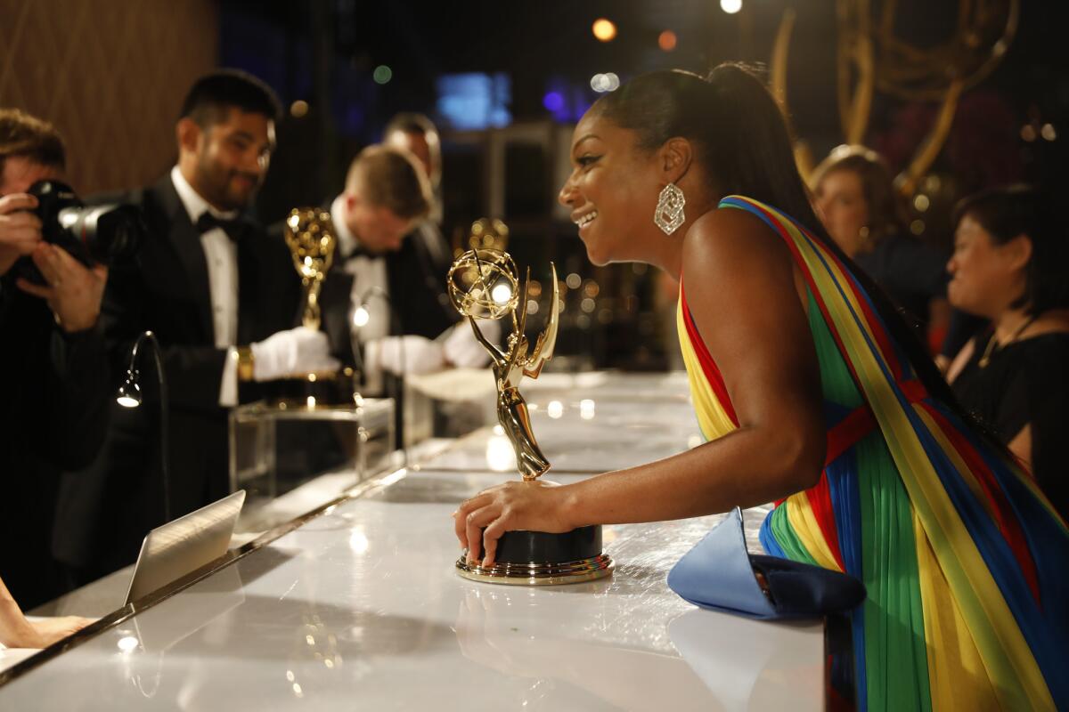 Emmy winner Tiffany Haddish waits to have her Emmy engraved at the Governors Ball.