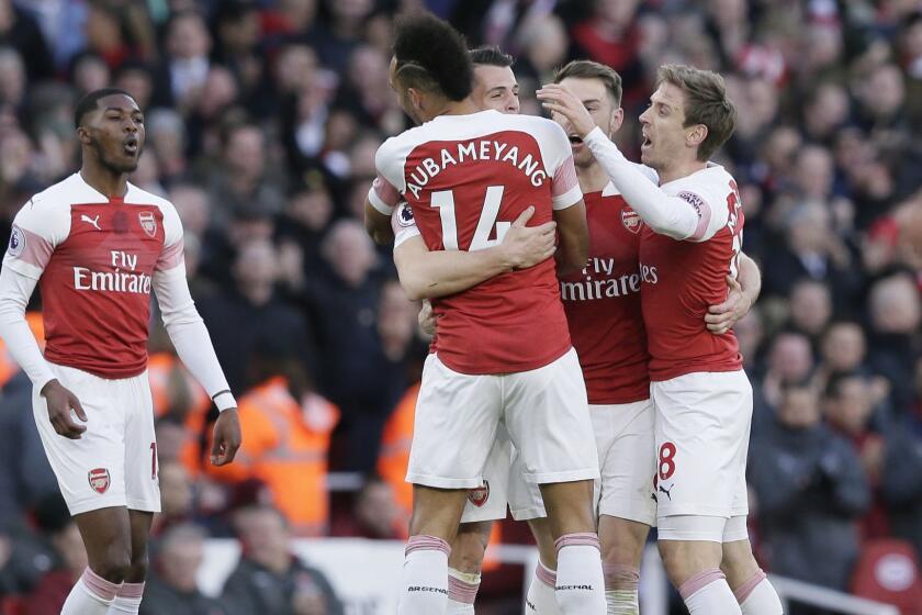 Arsenal players celebrate after Arsenal's Granit Xhaka scored his side's opening goal during the English Premier League soccer match between Arsenal and Manchester United at the Emirates Stadium in London, Sunday, March 10, 2019. (AP Photo/Tim Ireland)