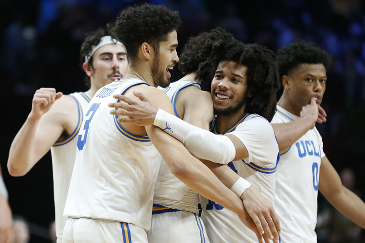 UCLA players celebrate their victory over Akron.