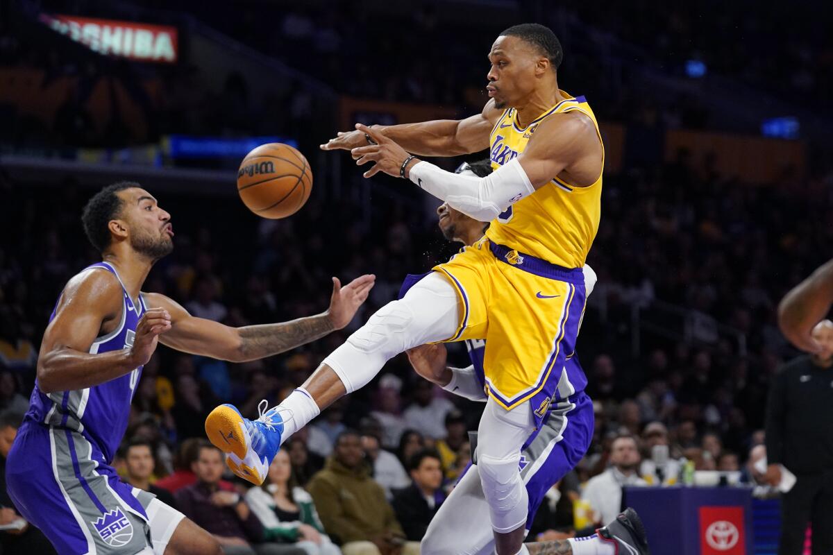 Russell Westbrook passes the ball for the Lakers