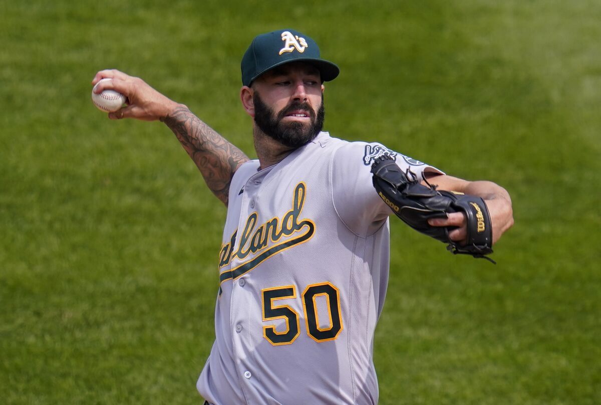 Oakland Athletics starting pitcher Mike Fiers (50) throws against the Colorado Rockies during the first inning of a baseball game, Wednesday, Sept. 16, 2020, in Denver. (AP Photo/Jack Dempsey)