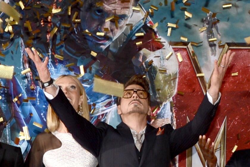 Robert Downey Jr. makes an entrance at the premiere of "Iron Man 3" at Hollywood's El Capitan Theatre.