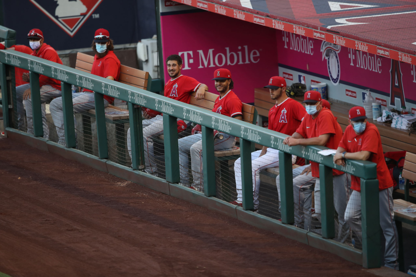 Angels players look on from the dugout during a intrasquad game at Angel Stadium.