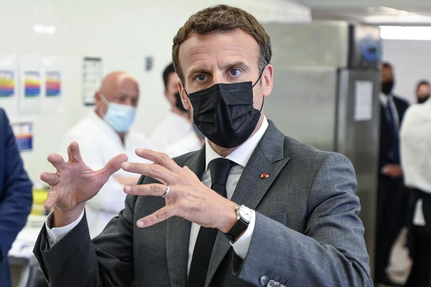 French President Emmanuel Macron talks to journalists Tuesday June 8, 2021 at the Hospitality school in Tain-l'Hermitage, southeastern France. French President Emmanuel Macron has been slapped in the face by a man during a visit in a small town of southeastern France, Macron's office confirmed. (Philippe Desmazes, Pool via AP)