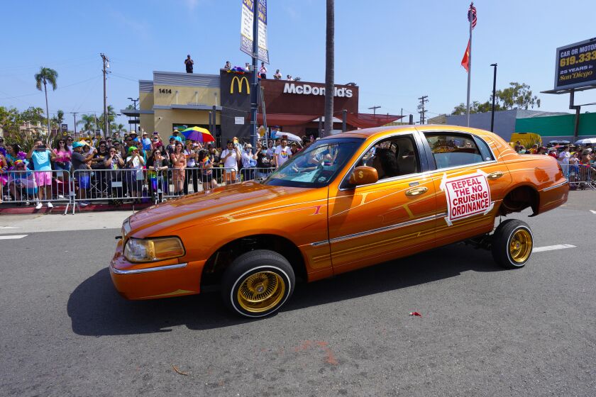 On Saturday, July 16, 2022 in San Diego, CA., A fully customized lowrider cruises down University Avenue during San Diego Pride 2022. (Nelvin C. Cepeda / The San Diego Union-Tribune)