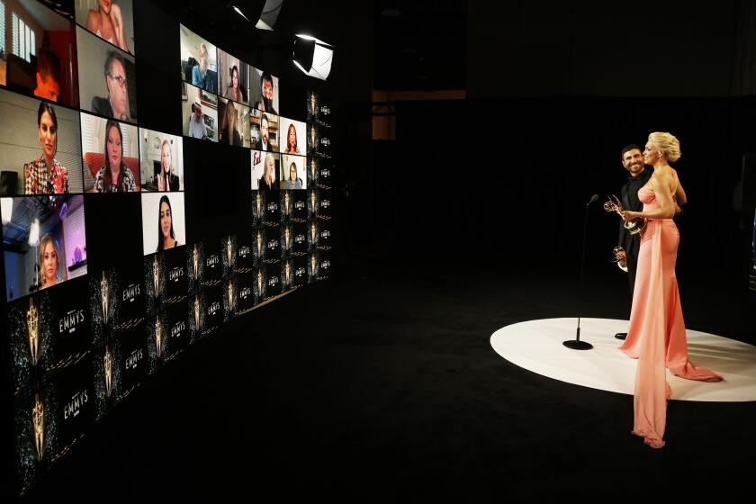 LOS ANGELES, CA - SEPTEMBER 19: Brett Goldstein and Hannah Waddingham in the virtual pressroom for the 73rd Annual Emmy Awards taking place at LA Live on/ Sunday, Sept. 19, 2021 in Los Angeles, CA. (Al Seib / Los Angeles Times)