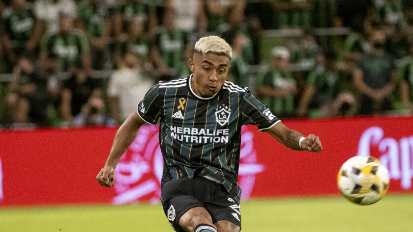 Galaxy defender Julian Araujo kicks the ball against Austin FC on Sept. 26 in Austin, Texas. 