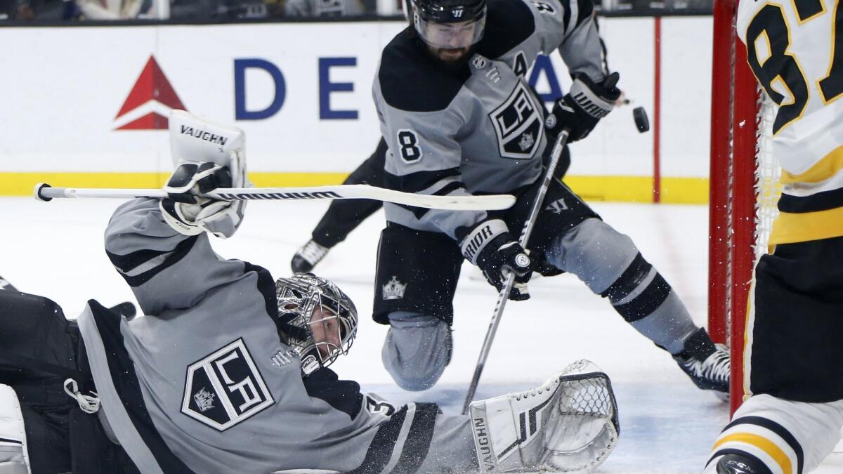 Kings goalie Jonathan Quick makes a save on a shot by Penguins forward Sidney Crosby during the third period.
