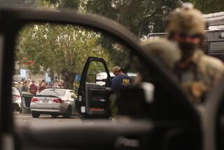 WILLOWBROOK, CA - JANUARY 21, 2026 - The silver BMW is at the center of a shooting as Border Patrol agents and other law enforcement investigate on Wednesday morning in Willowbrook on January 21, 2026. It prompted a large response from local and federal authorities. A spokesperson for the Los Angeles County Sheriff's Department said the U.S. Border Patrol or Department of Homeland Security was involved in the shooting near the intersection of 126th Street and Mona Boulevard. Shortly before 7:30 a.m., the Border Patrol informed the Sheriff's Department that the agency was conducting an operation in the area, according to the LASD. The shooting occurred shortly afterward. Genaro Molina/Los Angeles Times)
