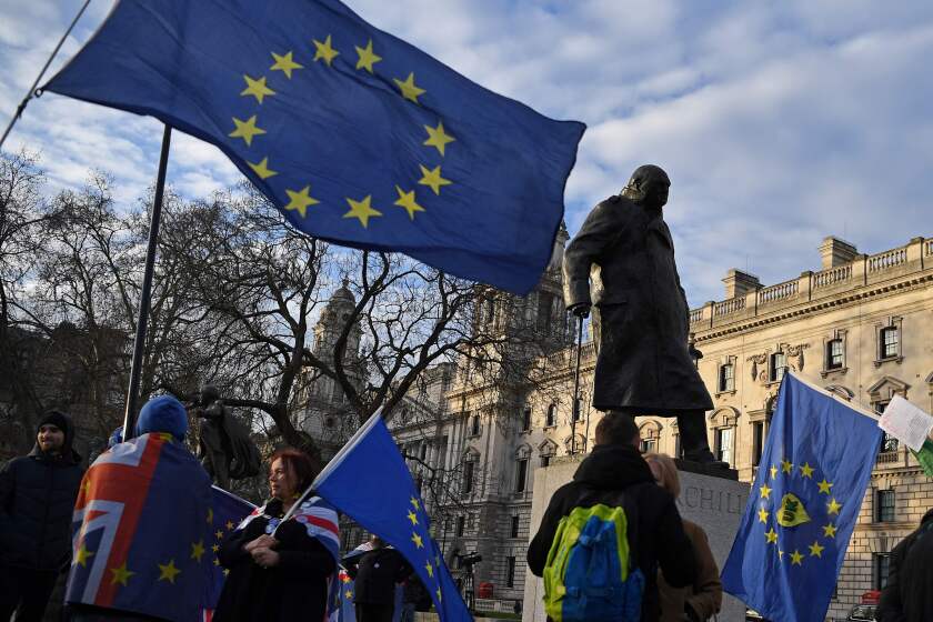 Anti-Brexit activists wave EU flags as they demonstrate near a statue of former British Prime Minister Winston Churchill, opposite the Houses of Parliament in central London on January 29, 2020. - Britain is set to formally leave the EU on the stroke of 2300GMT on January 31, 2020. (Photo by DANIEL LEAL-OLIVAS / AFP) (Photo by DANIEL LEAL-OLIVAS/AFP via Getty Images) ** OUTS - ELSENT, FPG, CM - OUTS * NM, PH, VA if sourced by CT, LA or MoD **