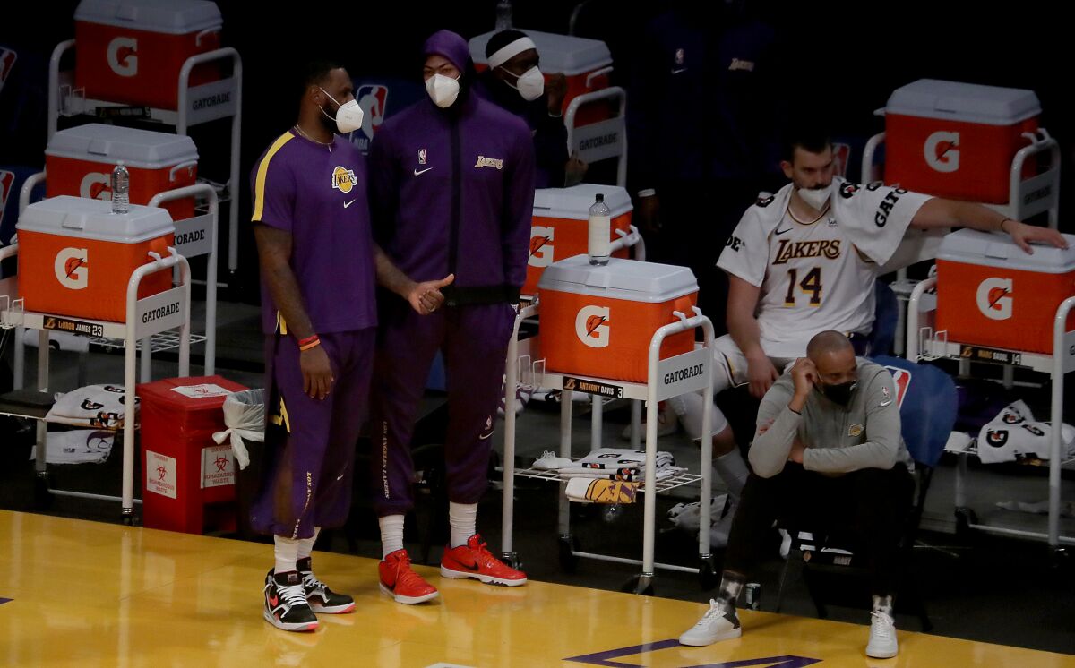 Lakers stars LeBron James and Anthony Davis sit out a presaason game against the Clippers on Dec. 13, 2020.
