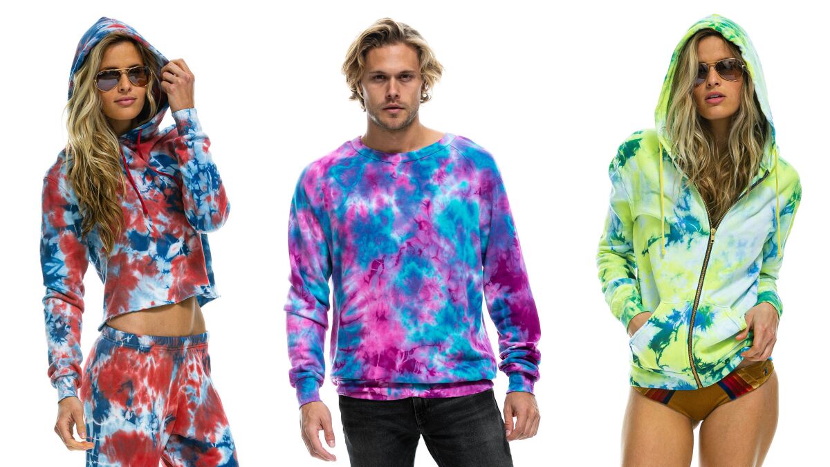 Three models in tie-dye apparel from Aviator Nation.