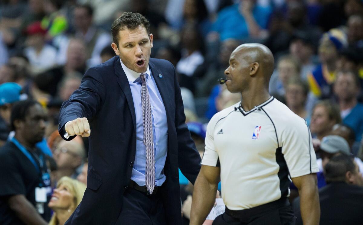 Lakers Coach Luke Walton, arguing a call while the Warriors' interim coach, is reportedly on the verge of making another hire for his coaching staff.