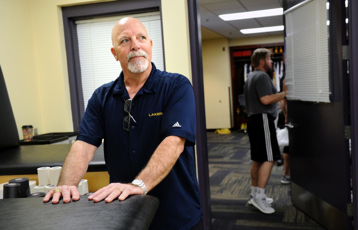 Lakers trainer Gary Vitti pauses in the locker room at Staples Center on March 28.