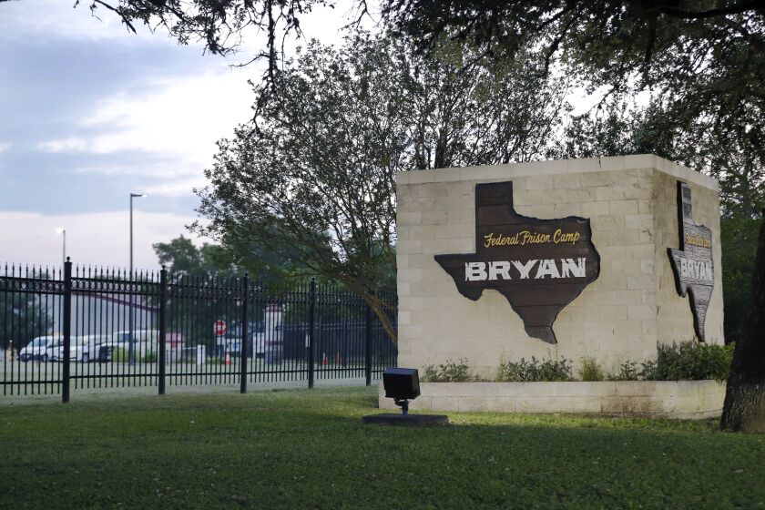 Dawn breaks at the Federal Prison Camp where Elizabeth Holmes, the former founder and CEO of Theranos, is expected to arrive to begin her 11 year sentence for fraud relating to the defunct company Tuesday, May 30, 2023, in Bryan, Texas. (AP Photo/Michael Wyke)