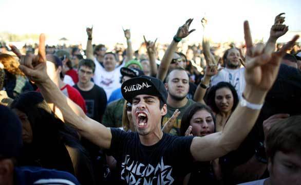 Festival-goers show their love for Suicidal Tendencies during the We the People music festival at Los Angeles State Historic Park on Saturday.