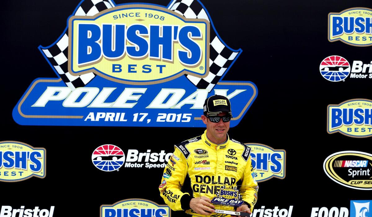 Matt Kenseth poses with the Bush's Best Pole Day award after qualifying for the pole position for the NASCAR Sprint Cup Series Food City 500 at Bristol Motor Speedway on Friday.