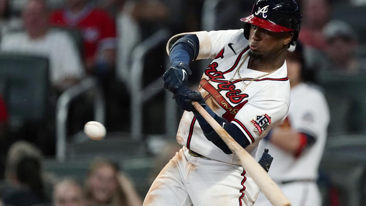 Albies hits slam, Braves rout burgundy-clad Phillies 15-7