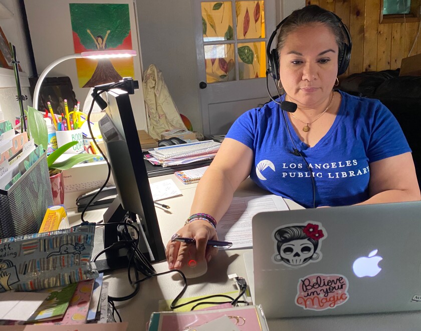 Lupie Leyva, a librarian at the Robert Louis Stevenson Library in Boyle Heights, does coronavirus contact tracing from home.