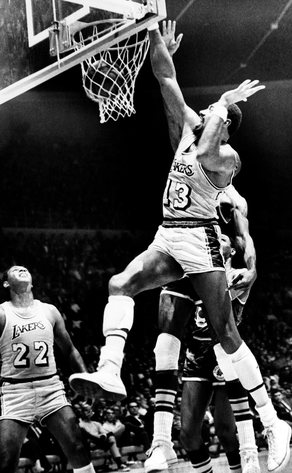 Wilt Chamberlain in his home court debut, drives in for a basket during National Basketball Association exhibition game against the San Francisco Warriors at the Forum in Inglewood, Calif., October 1, 1968.