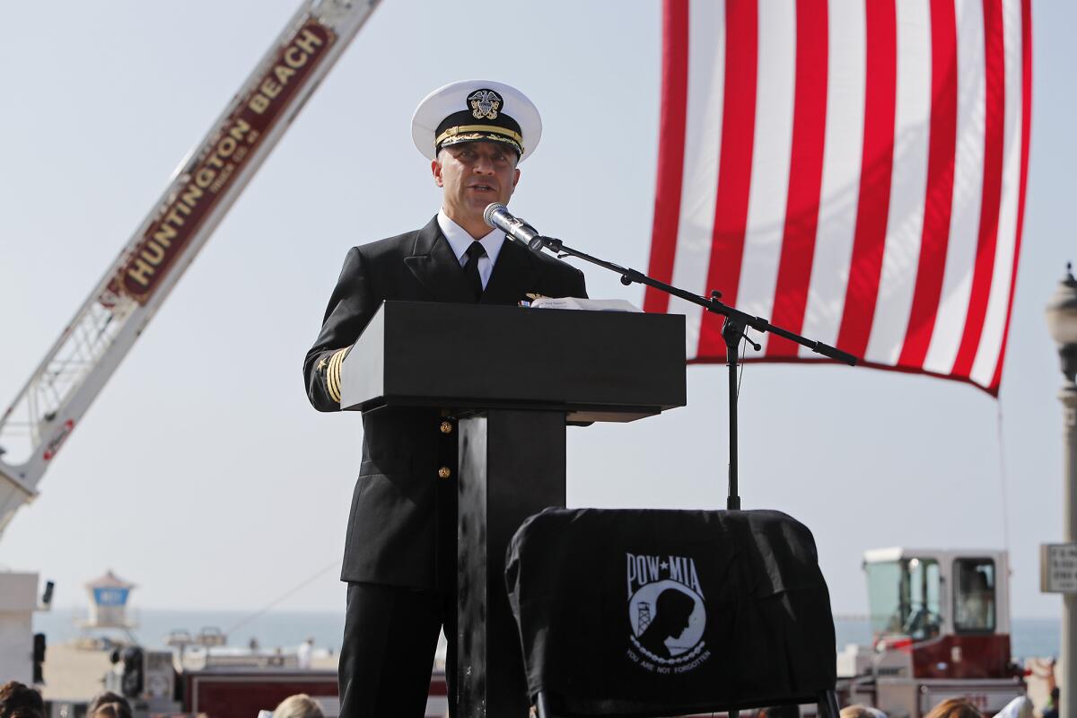 Capt. Jason Sherman of the Naval Weapons Station Seal Beach speaks during a ceremony at Pier Plaza in Huntington Beach.
