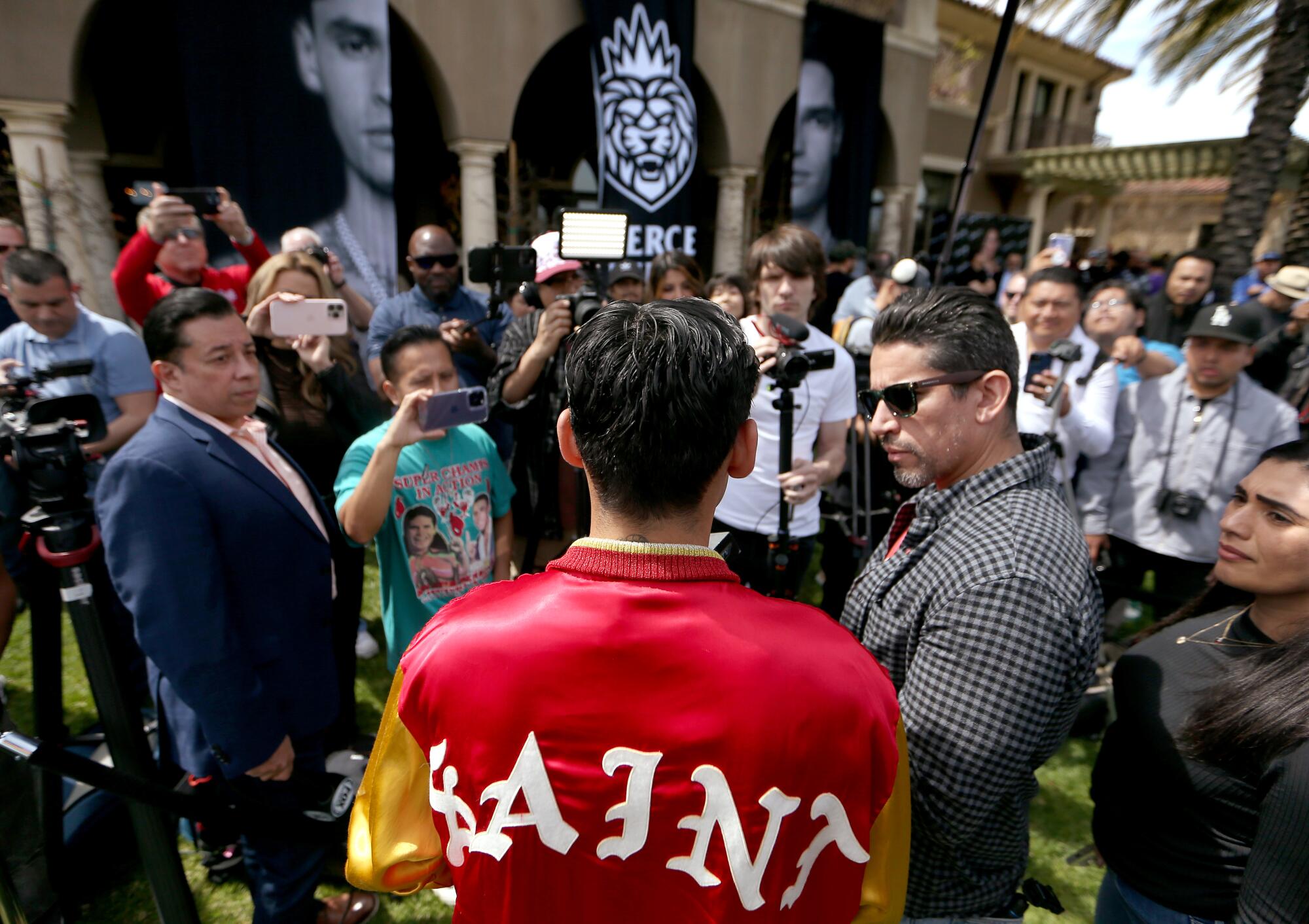 Boxer Ryan Garcia talks with members of the boxing press during his media day event at a mansion in Beverly Hills.
