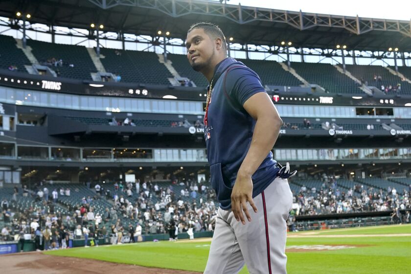 Minnesota Twins' Luis Arraez smiles at fans after the team's 10-1 win over the Chicago White Sox in a baseball game Wednesday, Oct. 5, 2022, in Chicago. (AP Photo/Nam Y. Huh)