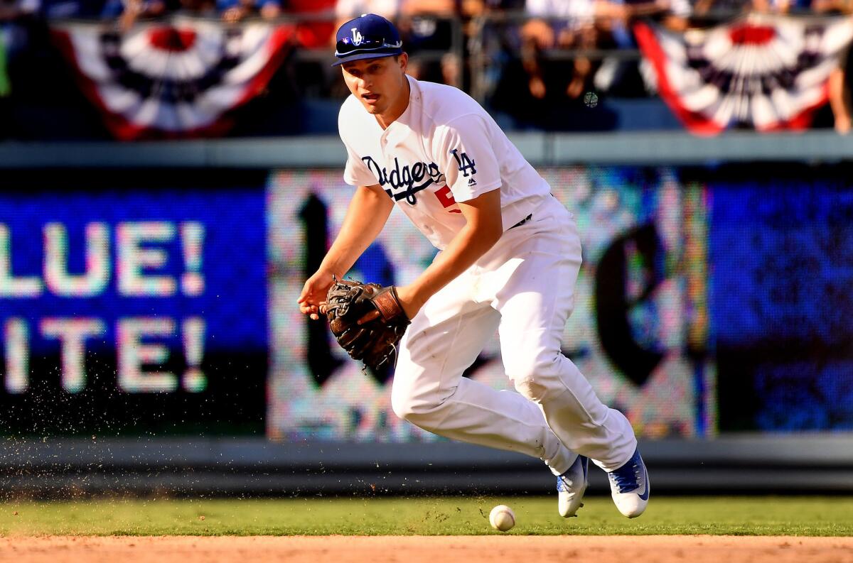 Dodgers shortstop Corey Seager drops the ball on a single by the Nationals' Ryan Zimmerman in the seventh inning of Game 3 of the 2017 NLDS.