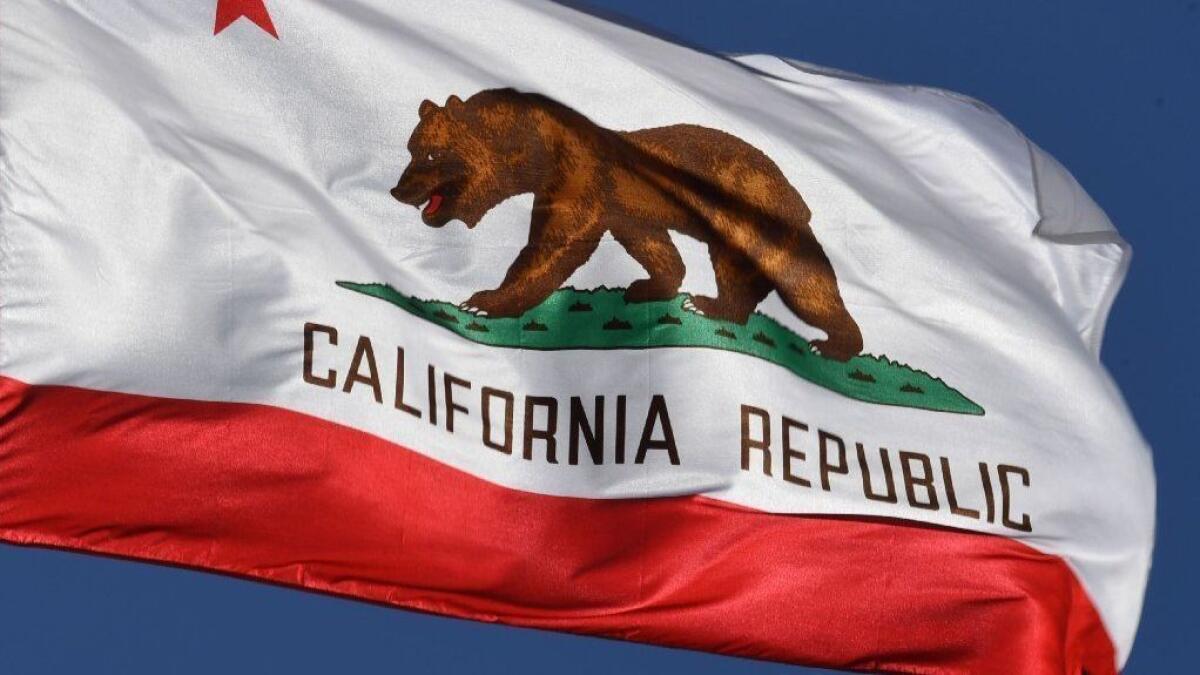 The California state flag flies outside L.A. City Hall in 2017.