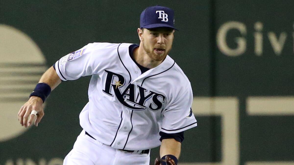 Tampa Bay Rays infielder Ben Zobrist chases down a hit during an all-star exhibition game in Japan in November. The Rays traded Zobrist to the Oakland Athletics on Saturday.