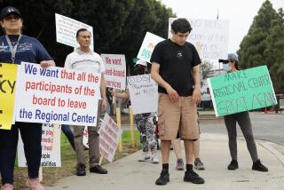 COSTA MESA CA - SEPTEMBER 29, 2022: Orange County families gather in protest over disability services targeting the California Department of Developmental Services and the Regional Center of Orange County, in Costa Mesa on September 29, 2022. (Christina House / Los Angeles Times)