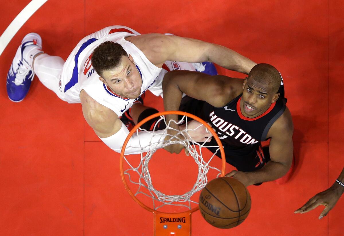 Blake Griffin and Chris Paul battle for a rebound.