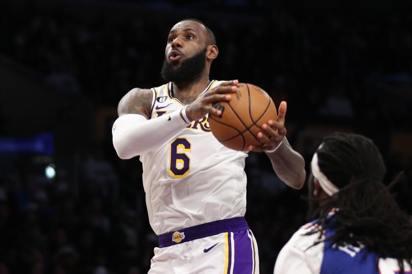 Los Angeles, CA - January 15: Lakers forward LeBron James drives to the hoop past 76ers.