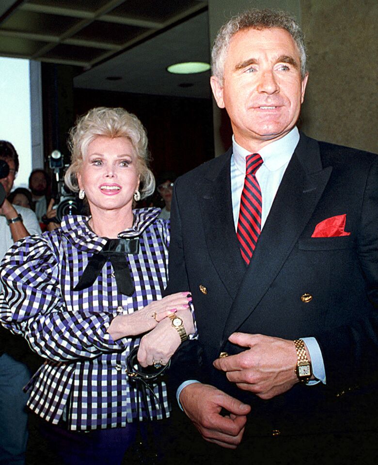 Gabor and Prince Frederic von Anhalt leave court in Beverly Hills in 1989. When she married him three years earlier, she told reporters he would be her last husband, and she was right.