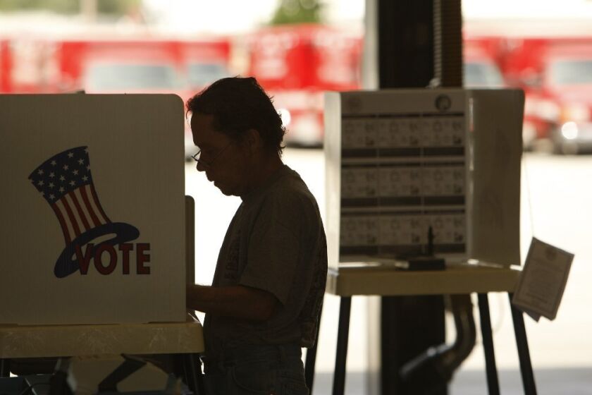 A voter fills in his ballot at a polling station in Sherman Oaks on May 21, 2013, the city of Los Angeles' election day.