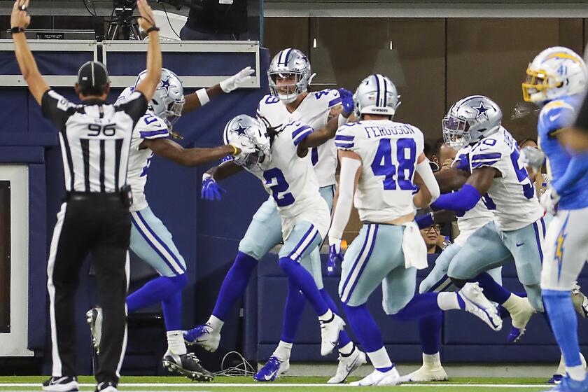 Inglewood, CA - August 20: Cowboys teammates celebrate wide receiver KaVontae Turpin's #2, kickoff return touchdown against the Los Angeles Chargers in the first quarter during pre-season game at SoFi Stadium, Inglewood, Saturday, Aug. 20, 2022. (Allen J. Schaben / Los Angeles Times)