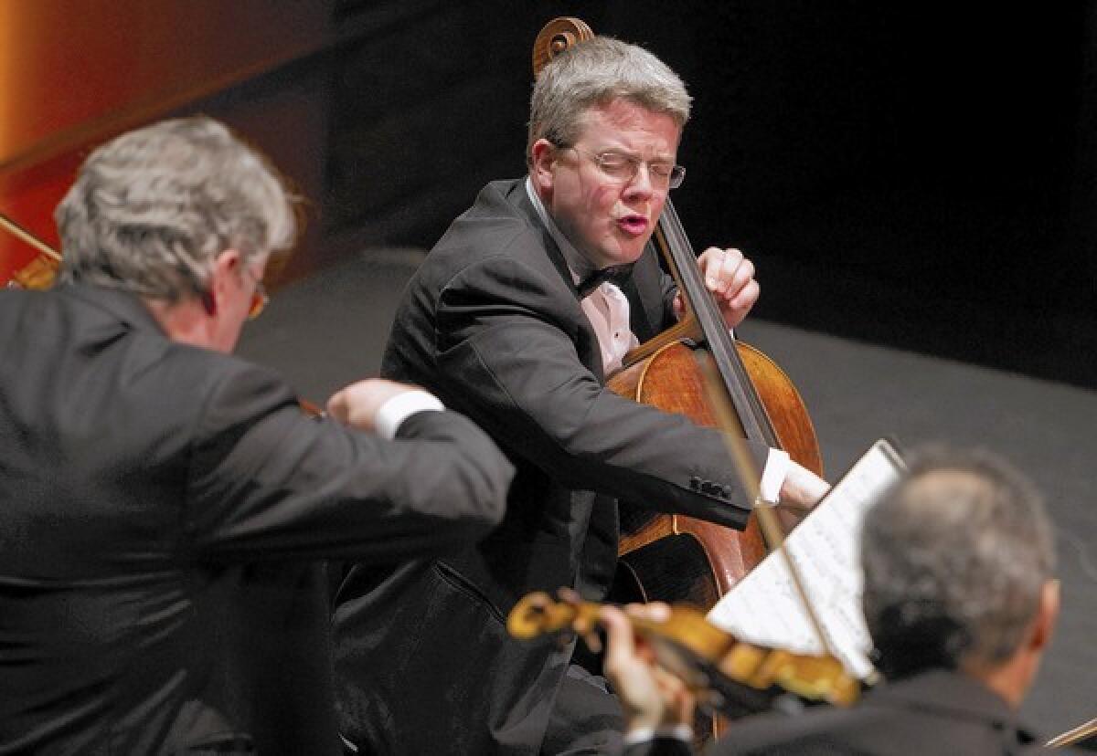 New cellist Paul Watkins, center, performs for the first time with the Emerson String Quartet.