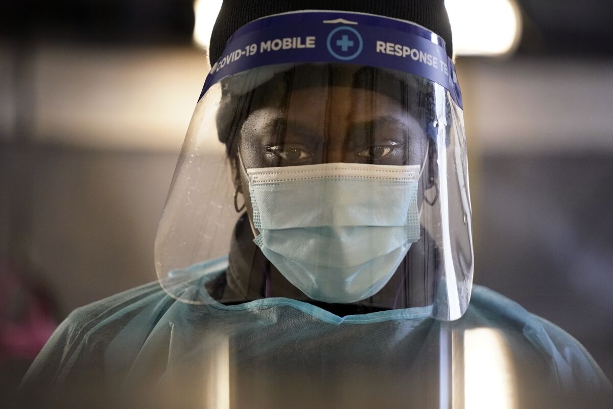 A healthcare worker wears personal protective equipment 
